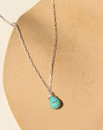Agave Necklace with a faceted sage green turquoise teardrop pendant on a reflective sterling silver box chain, designed for everyday wear and layering.