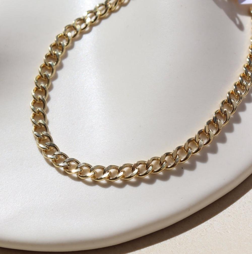 Demi Alexandra Bracelet laid on a white plate in the sunlight