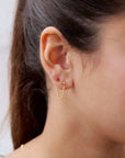 model wearing 14k gold fill small curb chain stud earrings with ruby stud earring