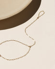 14k gold fill hand chain on a light background