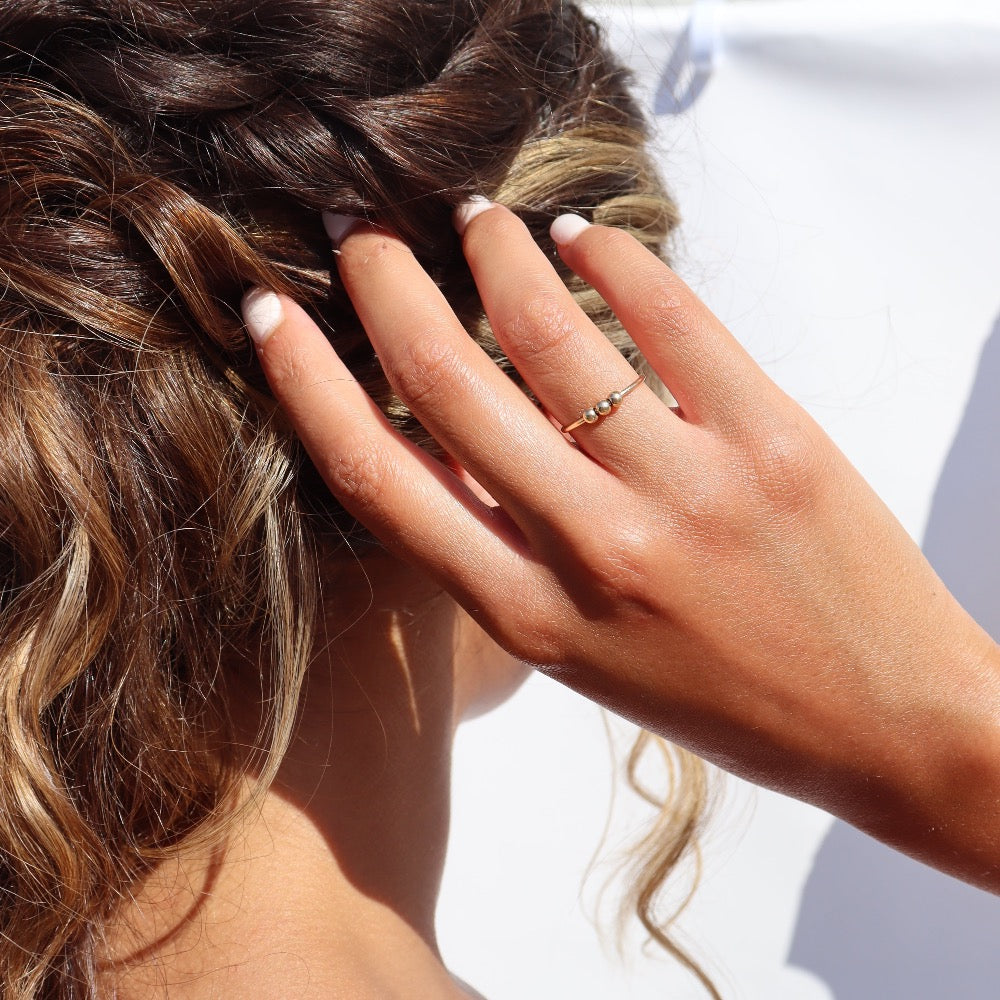 Model wearing 14k gold fill Meridian Fidget Ring