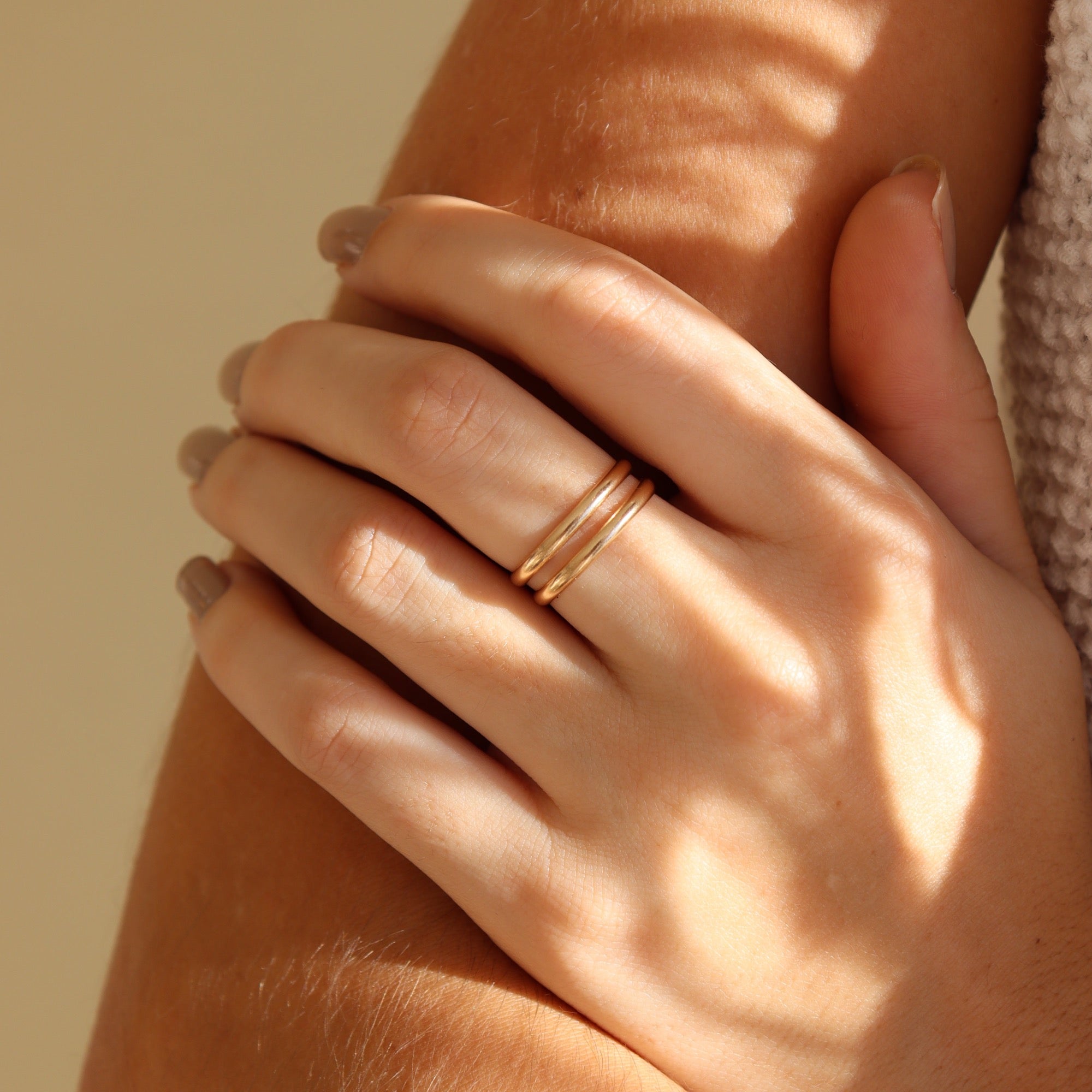 Model wearing two 14k gold fill circle