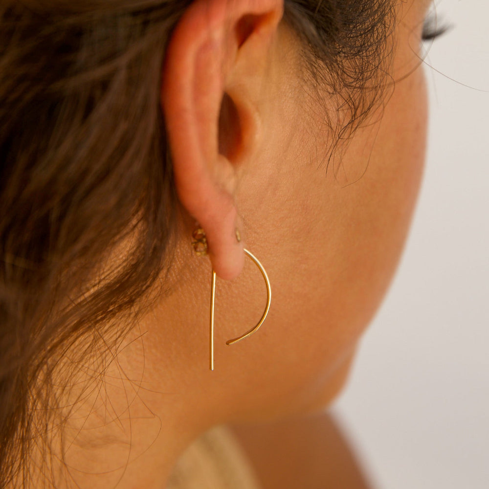 Model wearing 14k gold fill, P shaped threaders