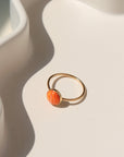 Sienna Ring featuring a vibrant spiny oyster gemstone on a hand-hammered  sterling silver band.