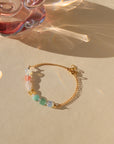multicolored heart beaded bracelet with 14k gold fill chain in the sunlight