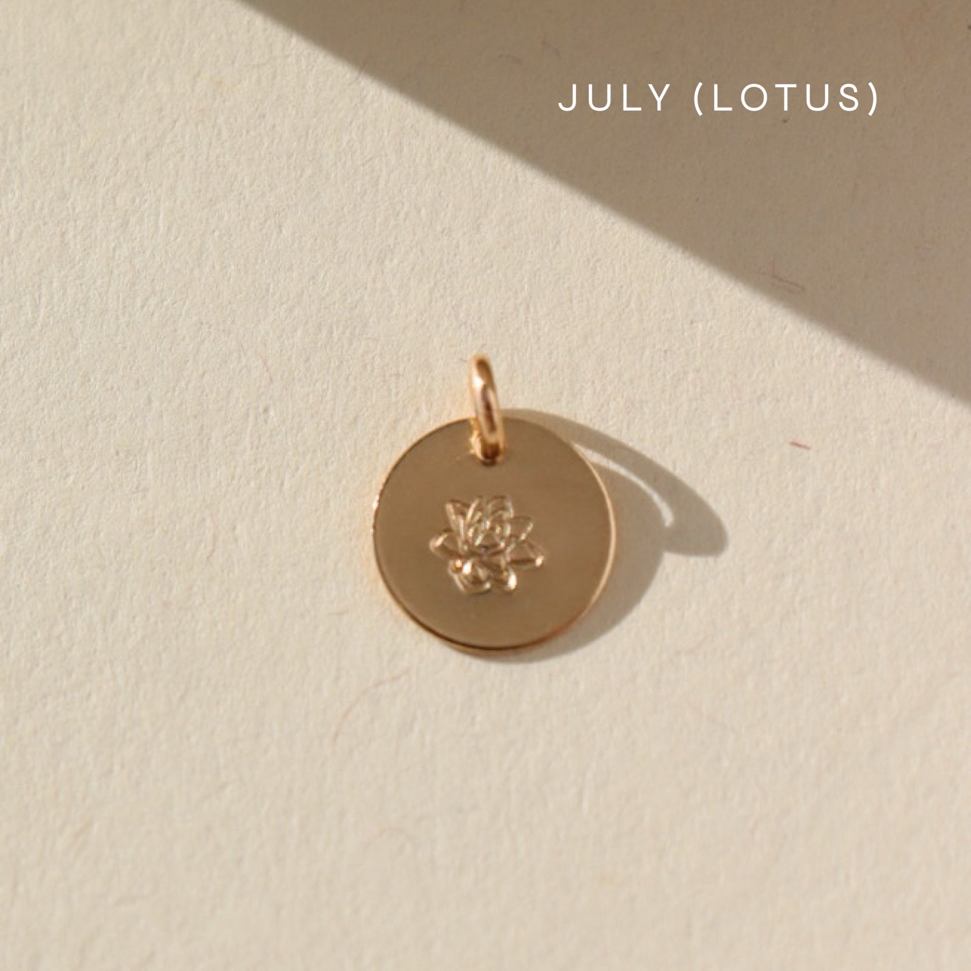 Birth Flower Charm Mother's Day Gifts, Personalized Jewelry, Handmade Jewelry, Gold coin that features a flower stamped by Token Jewelry in Eau Claire, WI