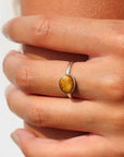 925 sterling silver tigers eye ring by Token Jewelry, a sideways bezel ring featuring a beautiful yellow-gold gemstone