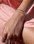 Model found wearing 14k gold fill Starlight Bracelet, also worn with multiple different rings plus an additional bracelet. 