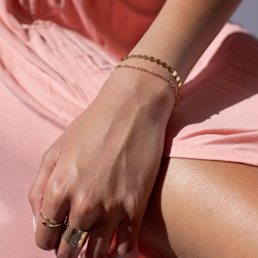 Model found wearing 14k gold fill Starlight Bracelet, also worn with multiple different rings plus an additional bracelet. 