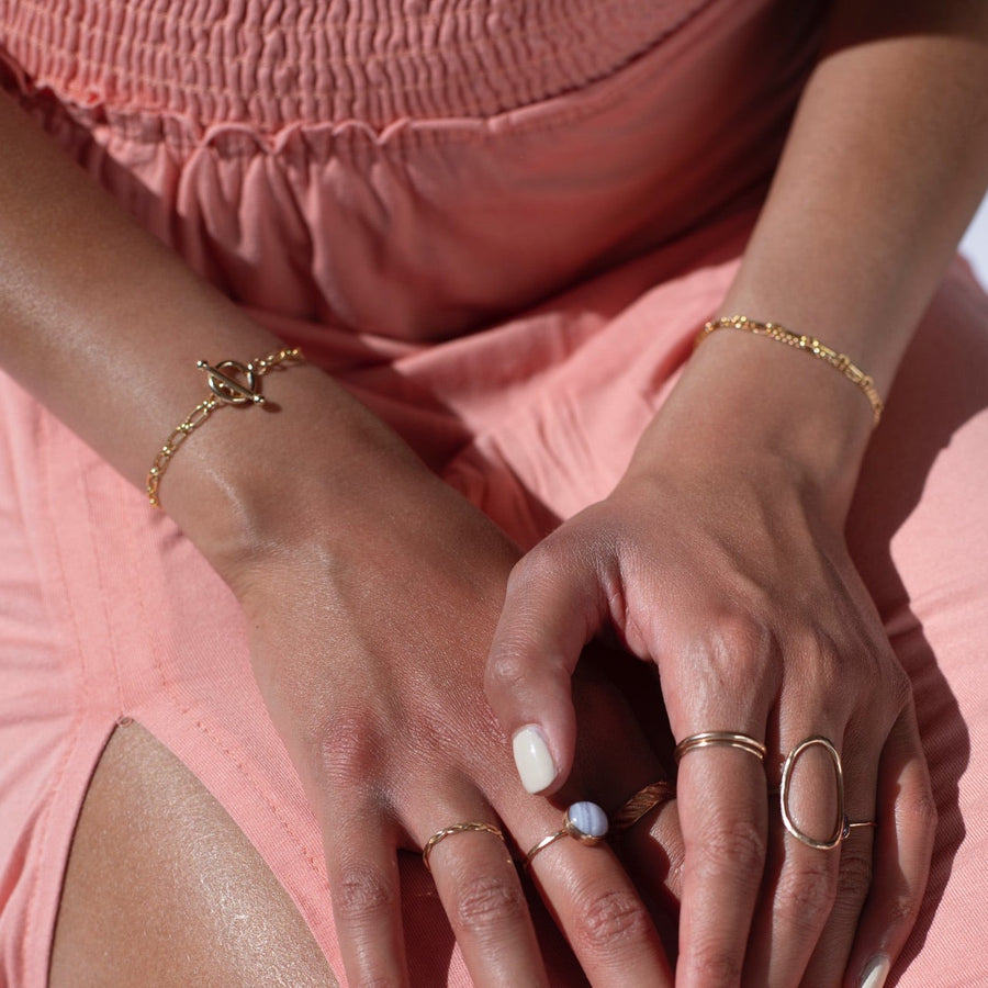 Model found wearing 14k gold fill Brooklyn Toggle Bracelet.