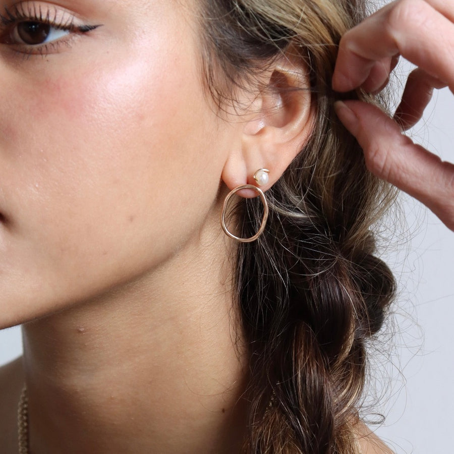 Model wearing 14k gold fill Emma pearl studs