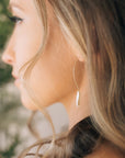 Model wearing 14k gold fill Juno earrings