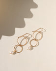 Ava Pearl Drop Earrings with minimalist gold ear wires and dangling freshwater pearls.