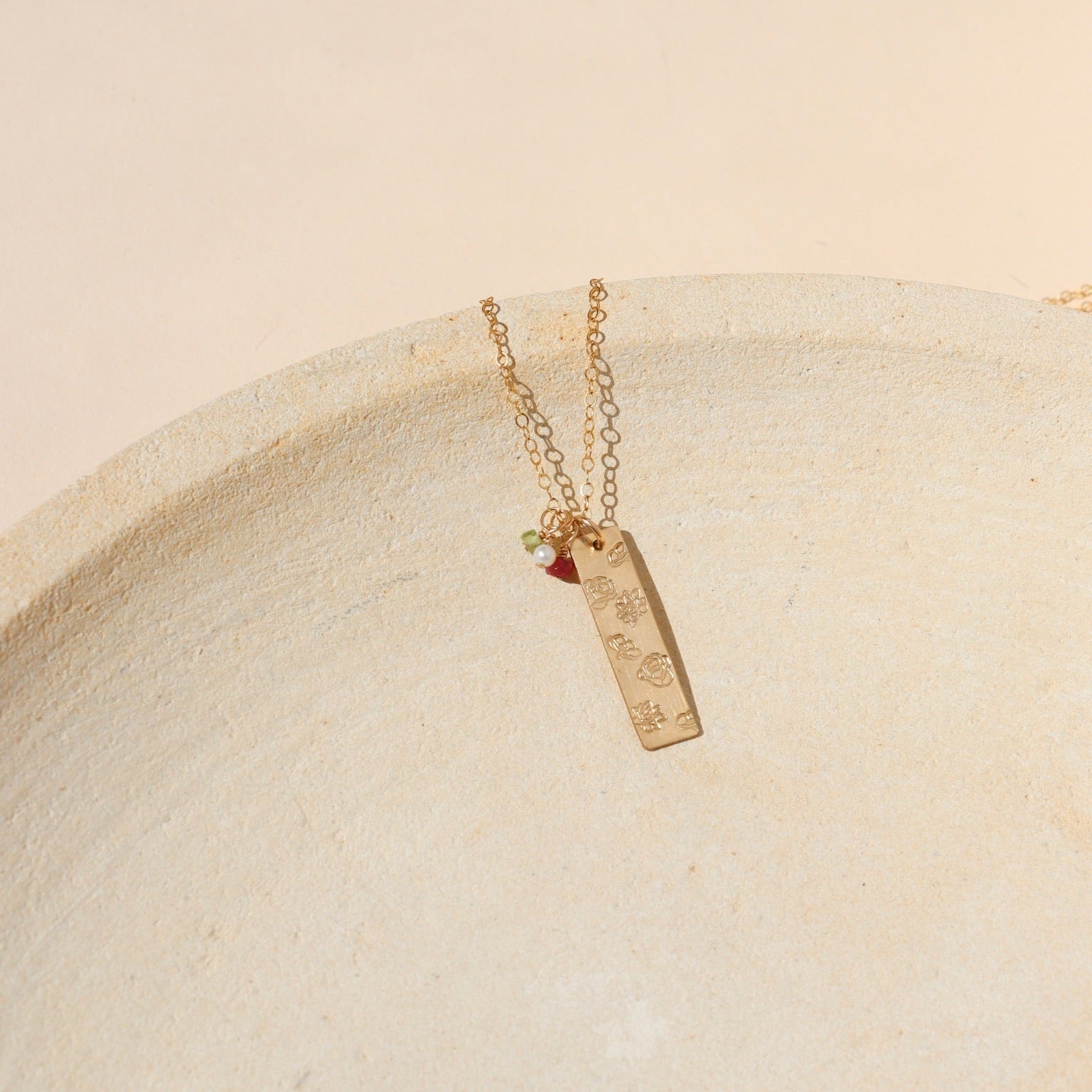 14k gold fill hand stamped bar pendant with flowers on a delicate chain with birthstone charms