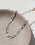 Brooklyn Bracelet in 925 Sterling silver on a gray plate in the sunlight