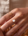 Buckle Ring worn with the essential opal ring