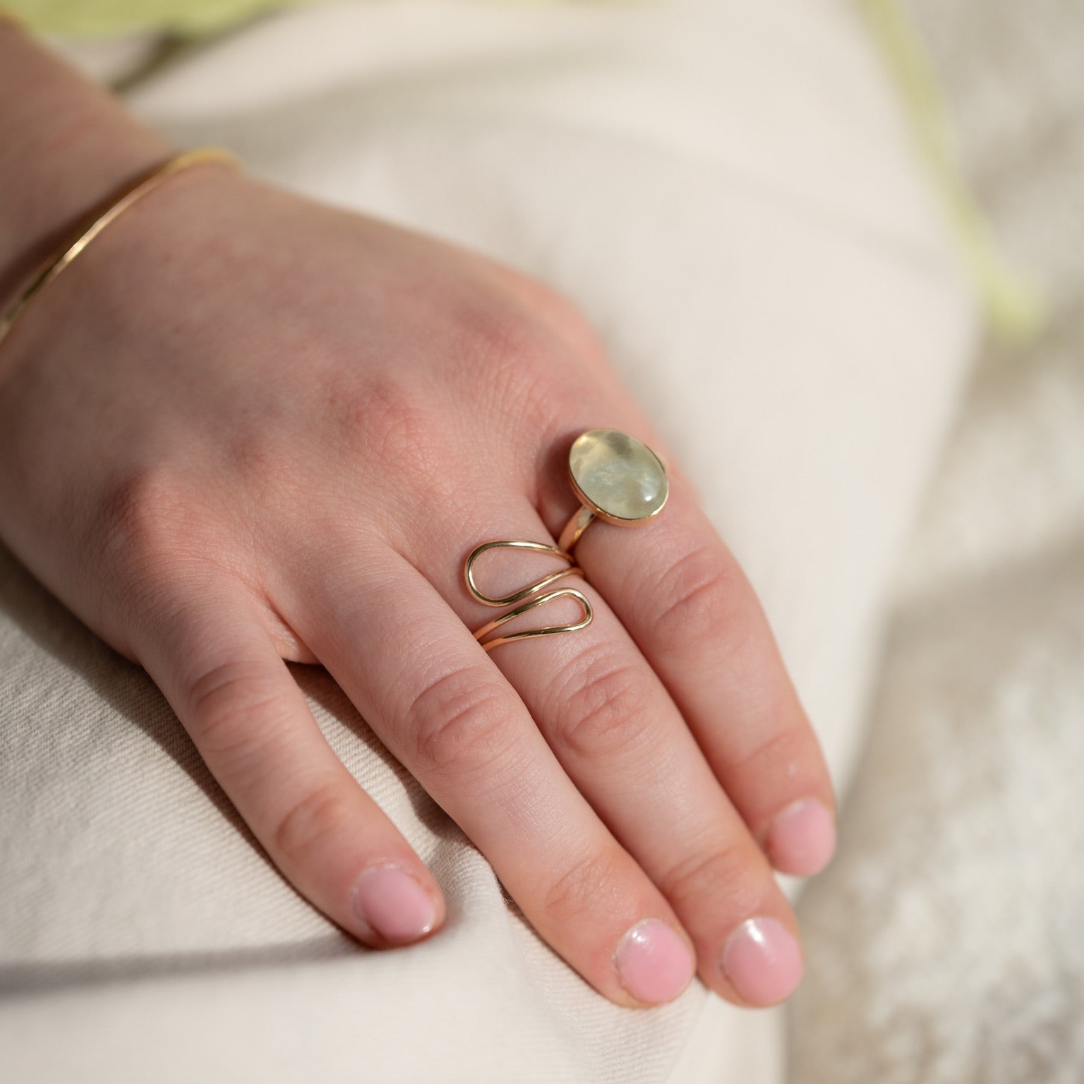 model wearing 14k gold fill wavy ring with prehnite ring
