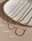 variety of 14k gold filled herringbone chains with lobster clasp closures available at Token Jewelry in Eau Claire, WI