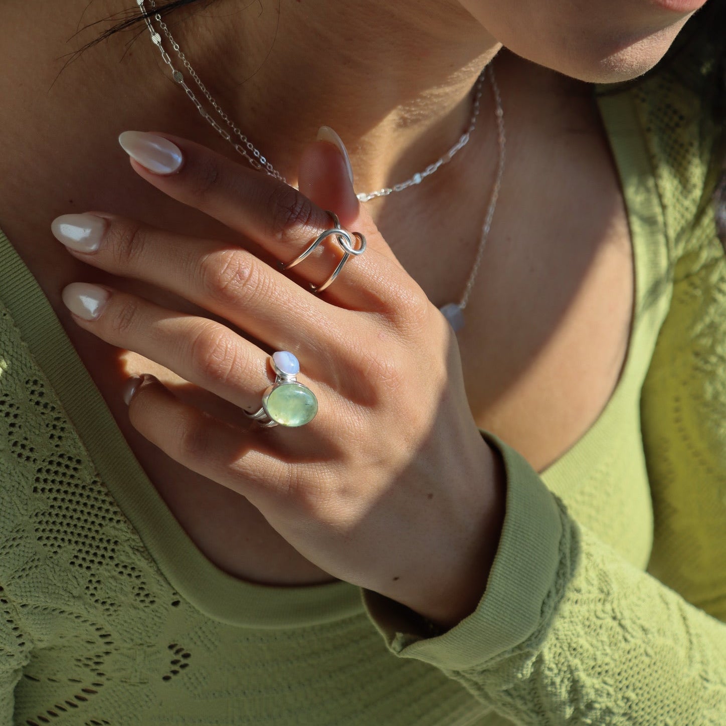 model wearing sterling silver jewelry with prehnite and agate stones