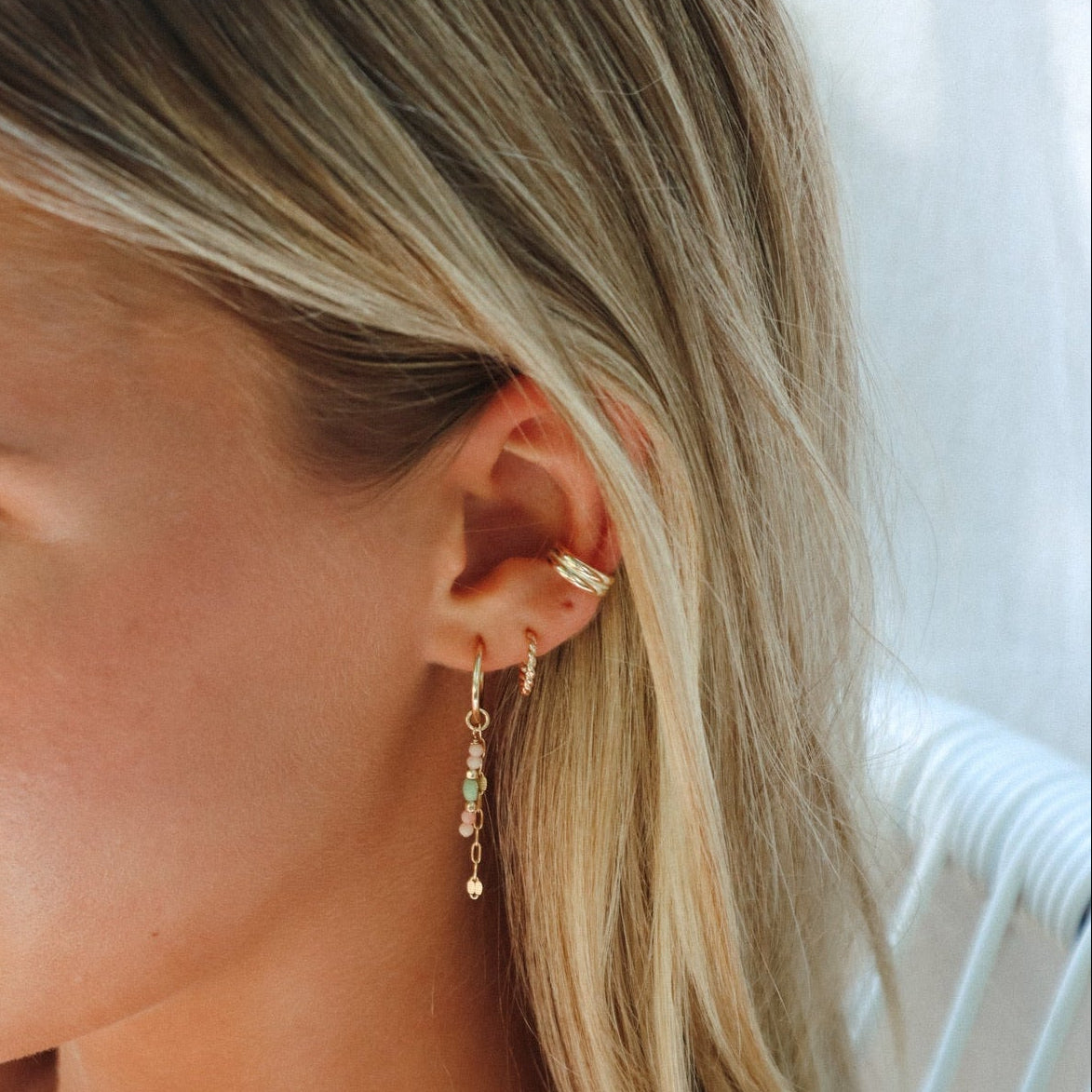 model wearing 14k gold fill hoops with coral and chryoprase beads and chain with 14k gold fill hoops and ear cuff