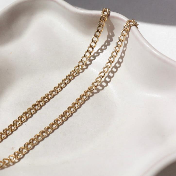 14k gold fill Demi Alexandra chain on a white plate