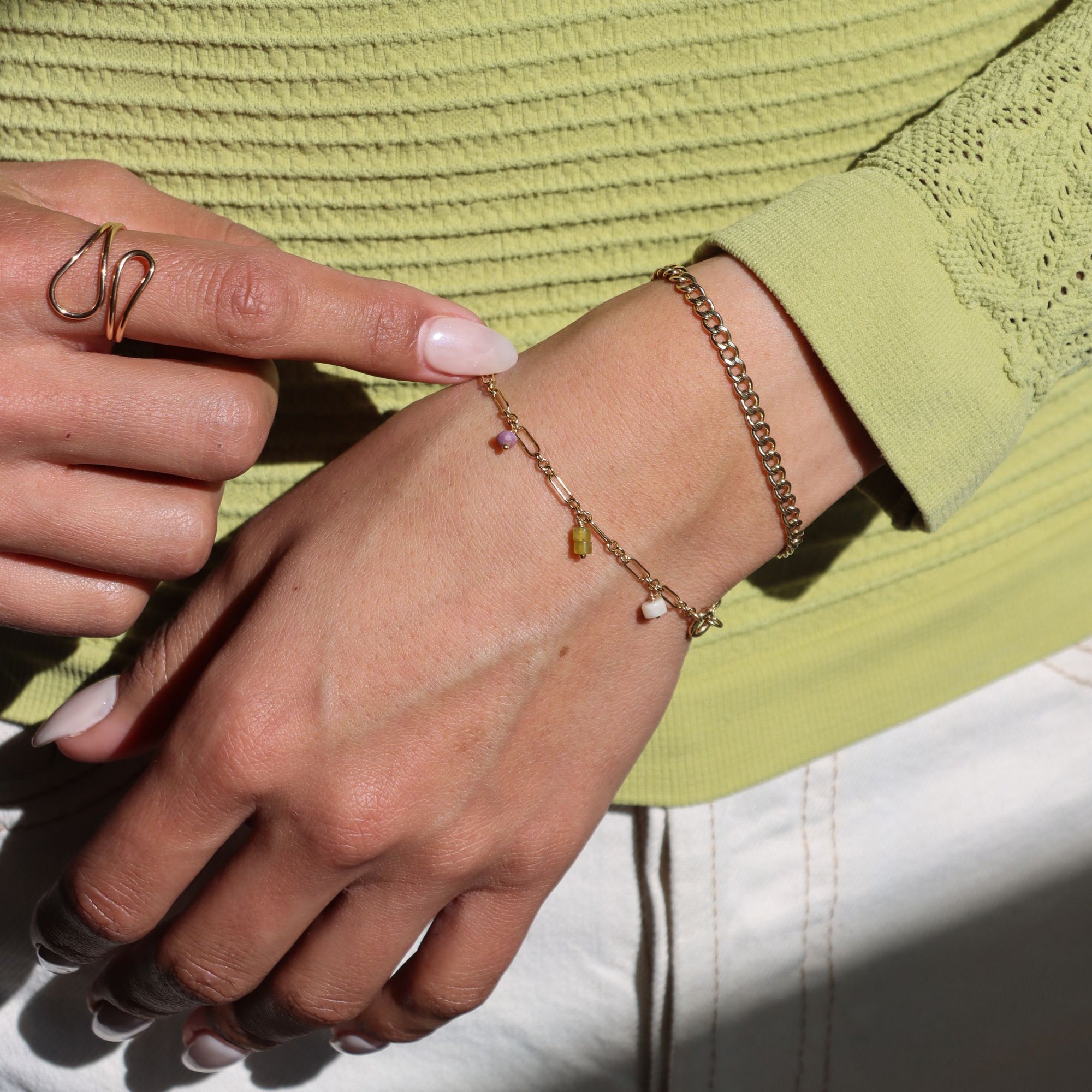 model wearing 14k gold fill charm bracelet with chain bracelet