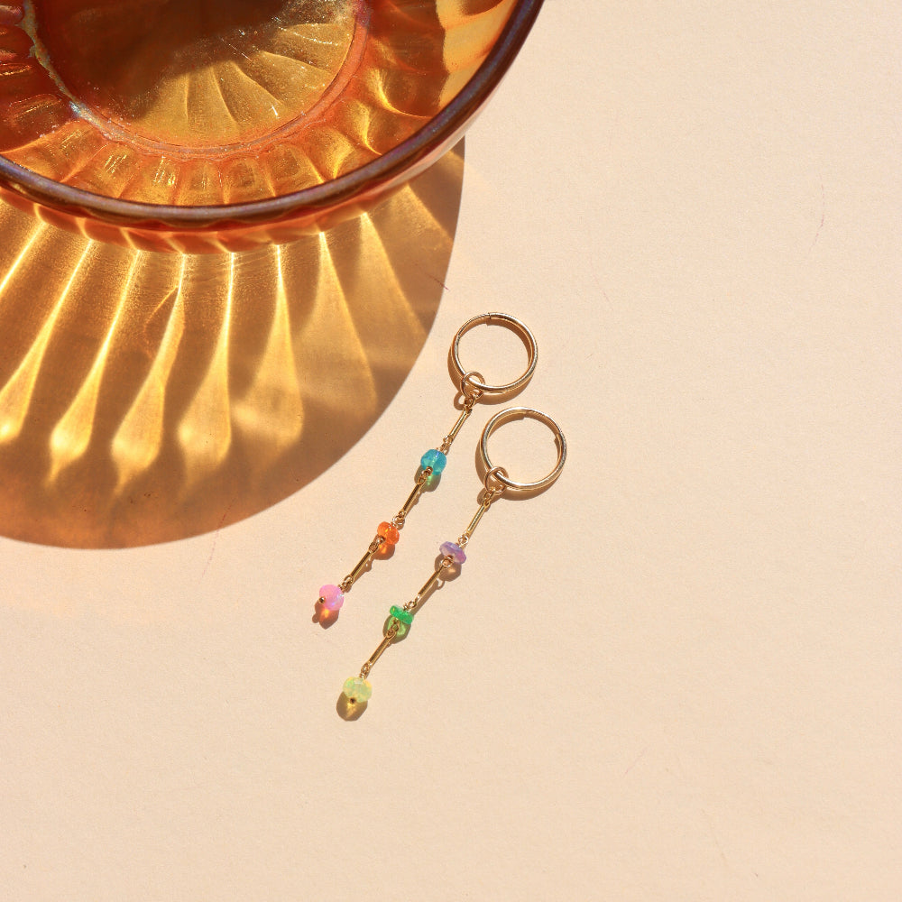 Disco Drop Earrings with colorful opals hanging from links.