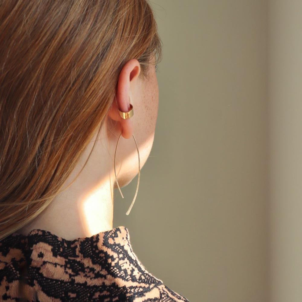 model wearing 14k gold fill hammered shaped earrings