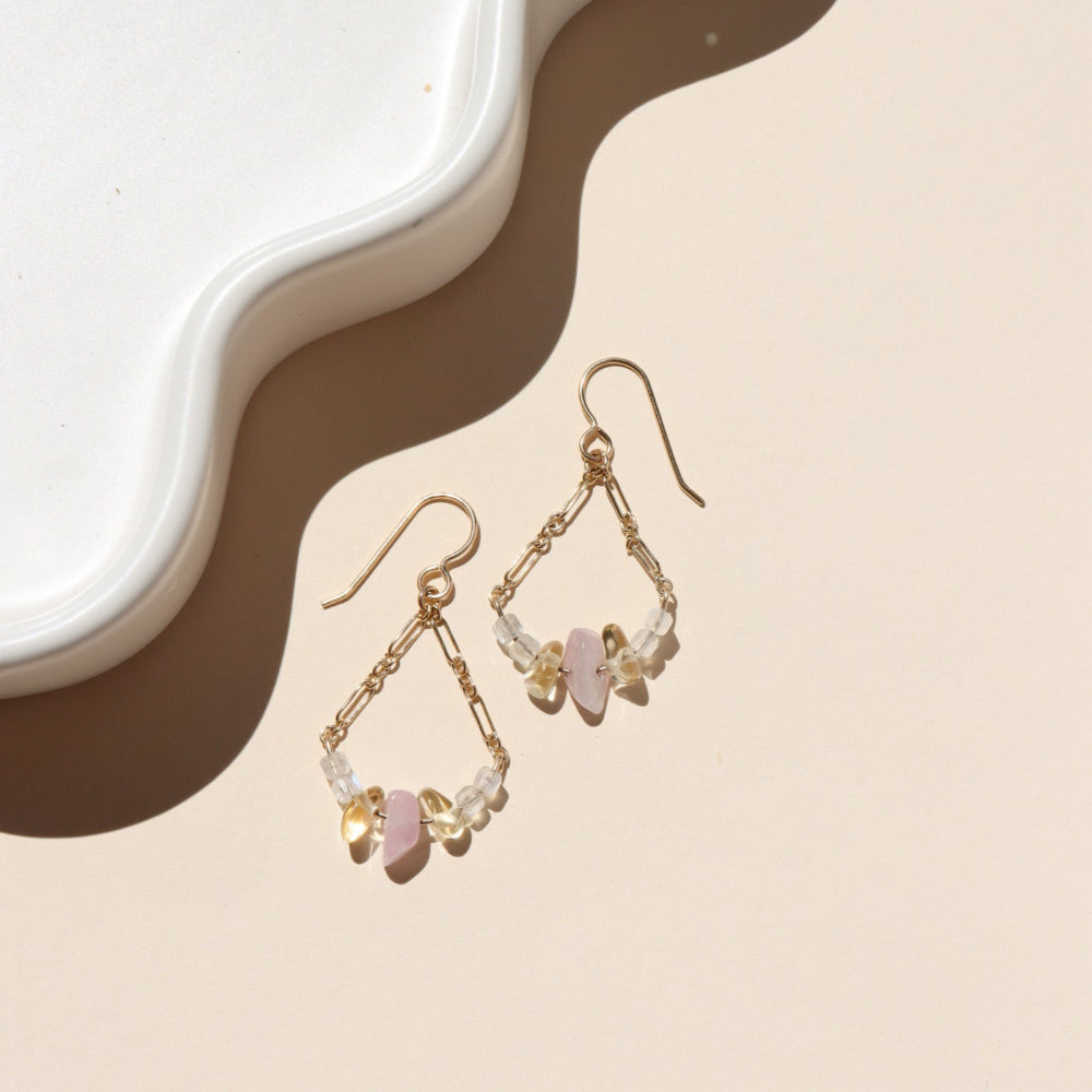 The Estella Earrings feature moonstone, kunzite, and citrine drops on a gold fill or sterling silver chain. Lightweight, feminine earrings with subtle movement.