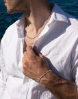 Model wearing 925 sterling silver Alex chain paired with la mer chain.