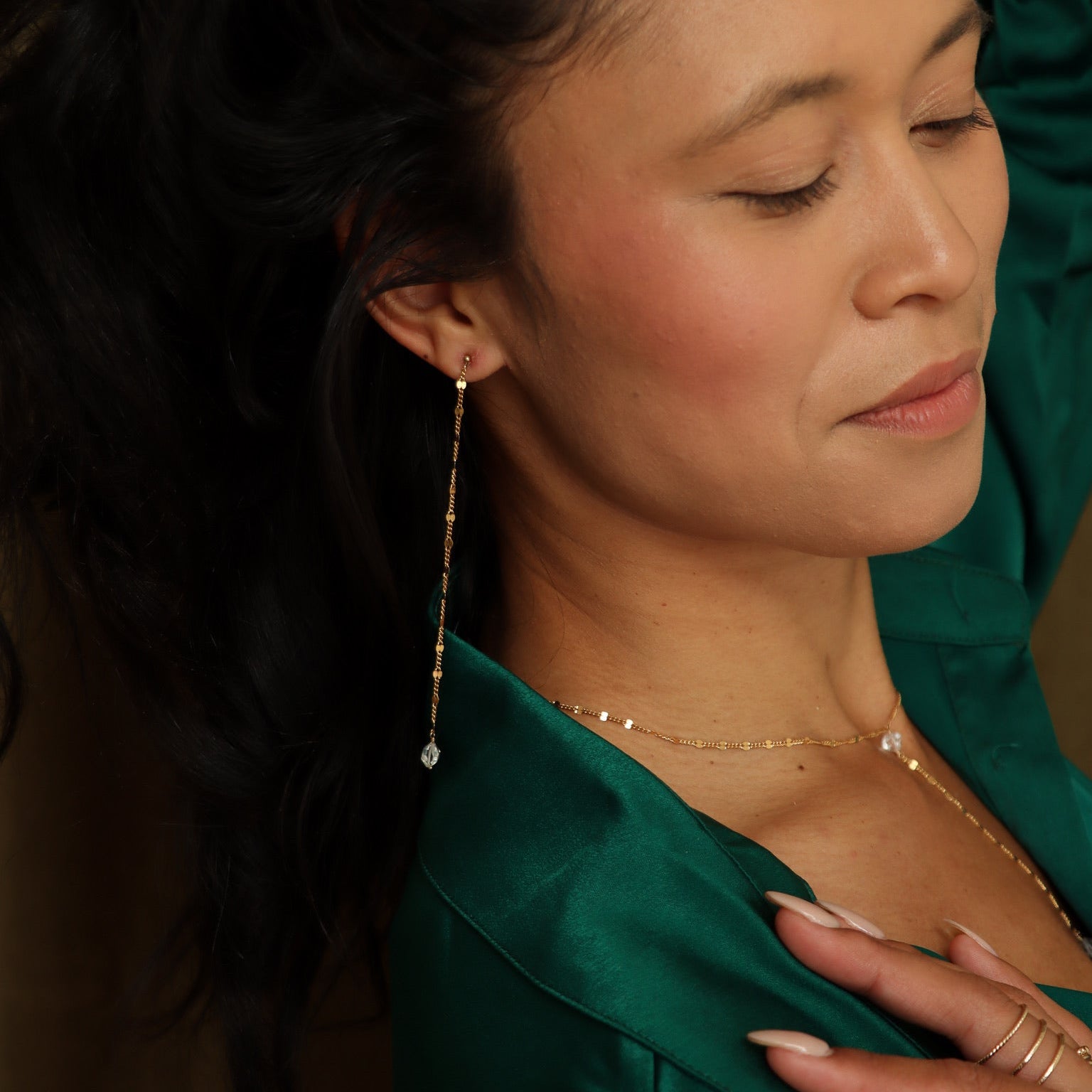 Model wearing gold-filled Herkimer Diamond drop earrings made with Sunburst chain. Minimal and dramatic, handmade for everyday glow.