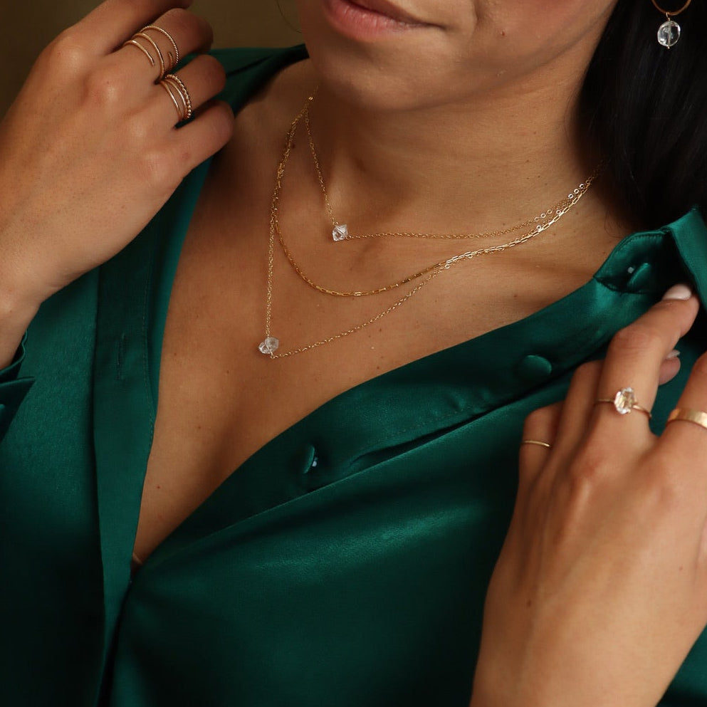 A radiant Herkimer diamond necklace with a naturally faceted quartz crystal, hand-set on a dainty gold chain for everyday elegance.