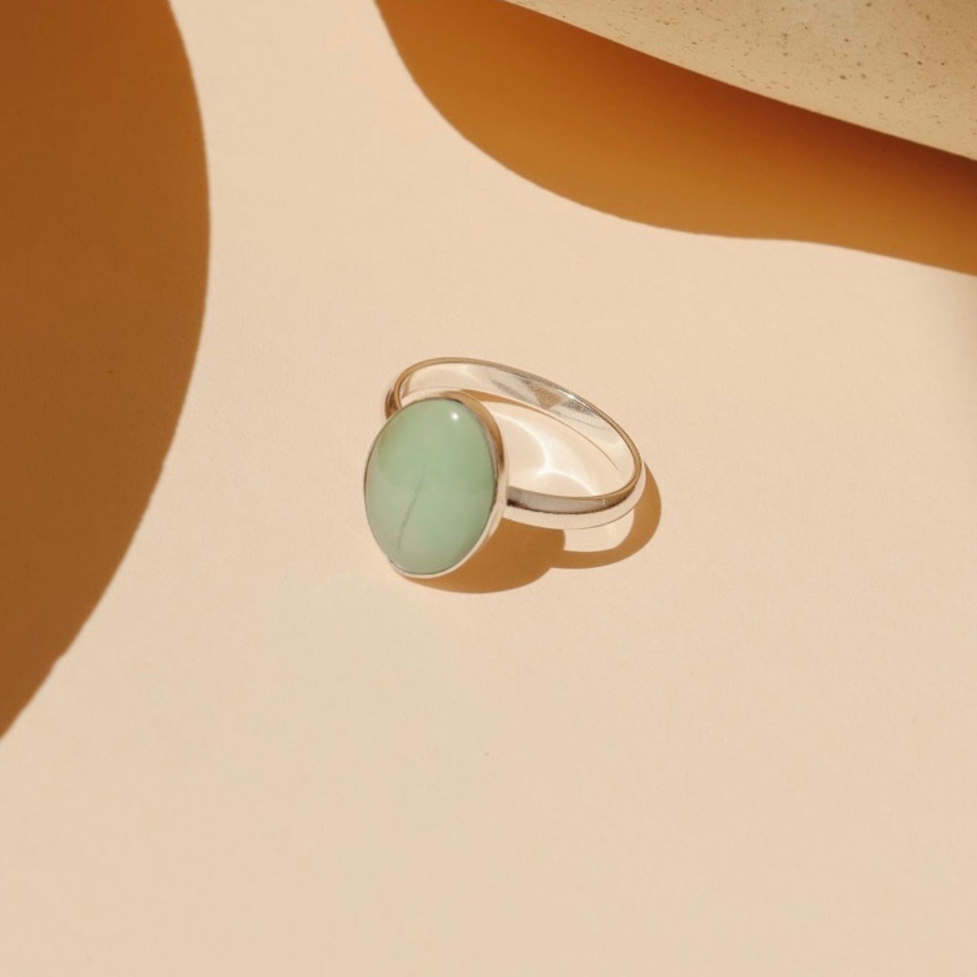 sterling silver ring with oval turquoise gemstone in the sunlight