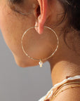 Model wearing 14k gold fill Emma pearl Hoops