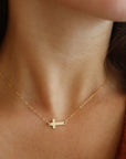 gold delicate cross chain necklace handmade in Eau Claire, Wisconsin by Token Jewelry