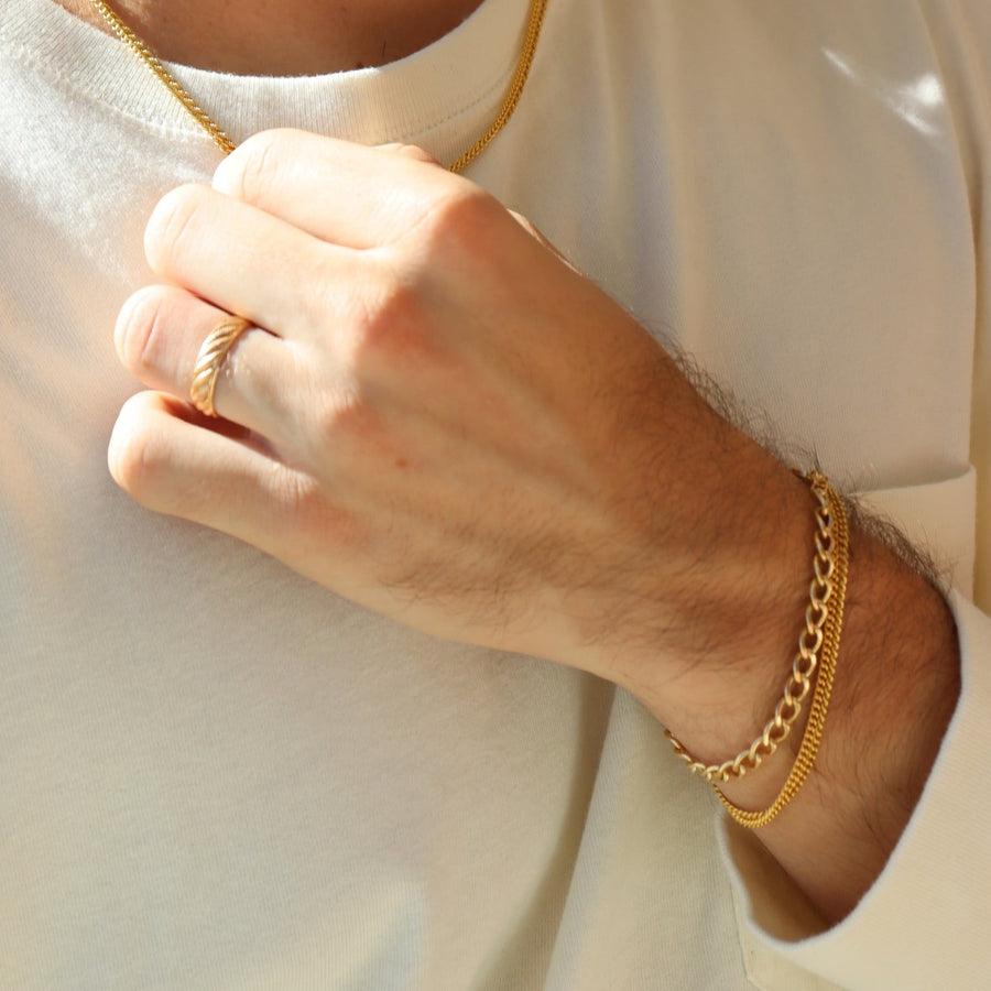 Model wearing 14k gold fill Alex Bracelet paired with the la mer bracelet.