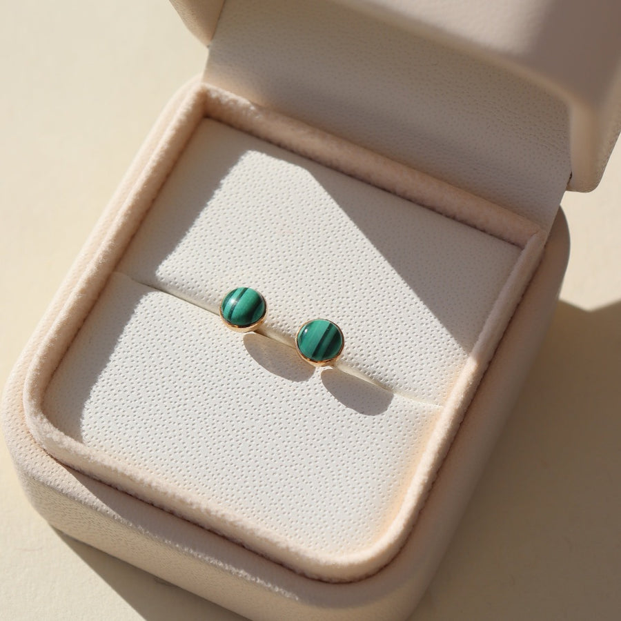 small stud 14k gold fill earrings with malachite stone photographed in a jewelry box | handmade by Token Jewelry in Eau Claire Wisconsin