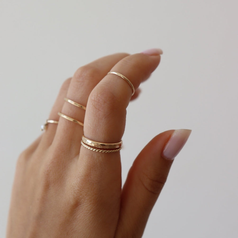 14k gold fill Minimal Midi Ring on models finger. This Ring features a simple band that is smooth perfect for everyday wear.