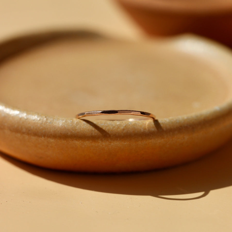 dainty hammered gold stacking ring handcrafted by Token Jewelry in Eau Claire, Wisconsin