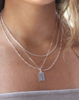 Model wearing 925 sterling silver Everly monogram necklace