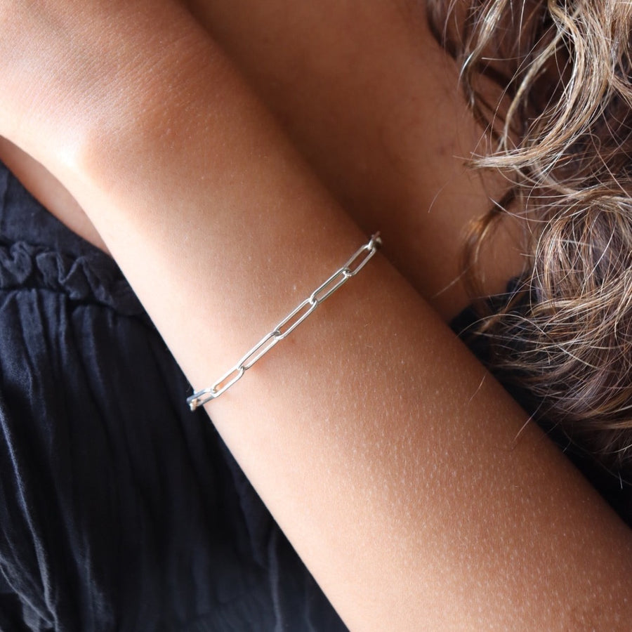 Model wearing 925 sterling silver China link bracelet