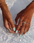 Model wearing 14k gold fill Trinity ring 