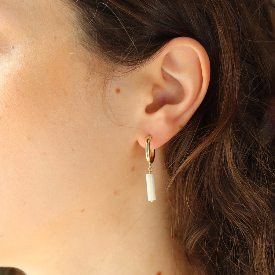 Model wearing Mother of Pearl Hoops.