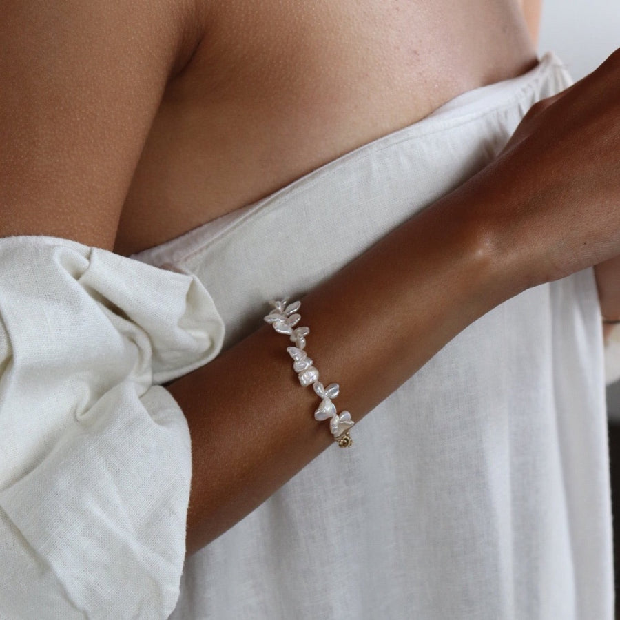 Model wearing 14k gold fill Pearl Petals Bracelet