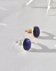 Lapis Lazuli Gemstone Ring in sterling silver and 14k gold fill, photographed on a white backdrop. This ring features a thick hammered band with a 12x16mm Lapis gemstone. 
