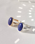Lapis Lazuli Gemstone Ring in sterling silver and 14k gold fill, photographed on a white backdrop. 