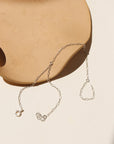 sterling silver hand chain on a light dish