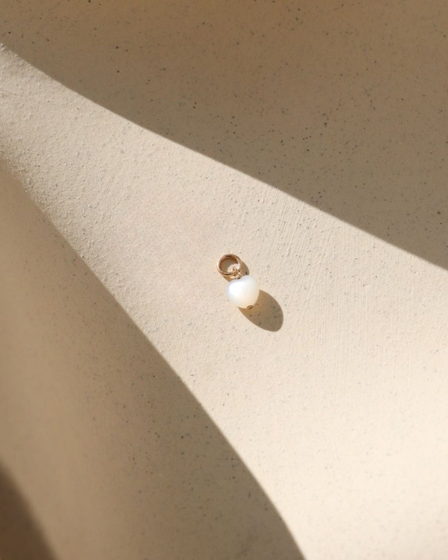 14k gold fill charm with mother of pearl heart bead