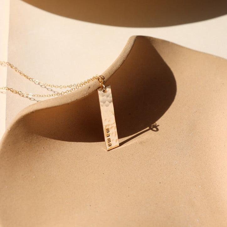 model wearing 14k gold fill sparkly chain with 14k gold fill delicate chain necklace with hand stamped bar charm