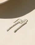 Handcrafted matchstick earrings in 14k gold fill or sterling silver, sleek and minimal with subtle texture, modern design perfect for layering or wearing alone.